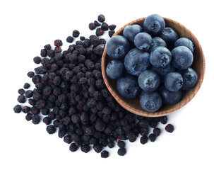 Sweet sublimated and fresh blueberries on white background, top view