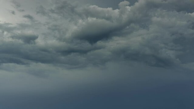 Timelapse of the dramatic and heavy clouds creating heart shape on the sky