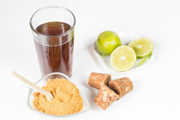 panela cubes and lemon or sugar cane candy on a white background, typical food from Colombia