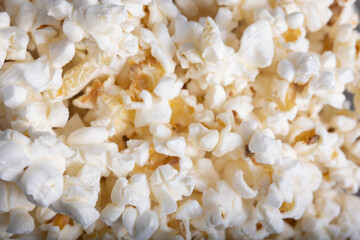 Overhead shot of lots of popcorn grouped together, a background of popcorn with butter and salt.