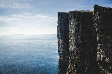 Slave Cliff in the Faroe Islands on a calm day with a clear sky, Denmark