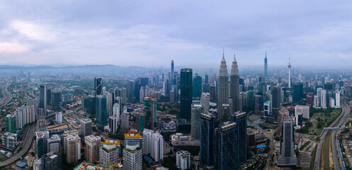 High angle view of sunrise at Kuala Lumpur city skyline with Petronas Twin Towers from Traders Hotel