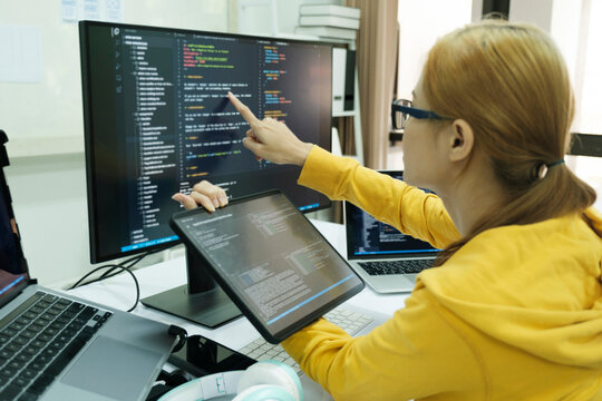 Close up programmer is coding and programming software.