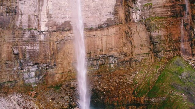 Beautiful scenery of a majestic Kinchkha waterfall, Georgia, Caucasus. Drone shot. High quality 4k footage
