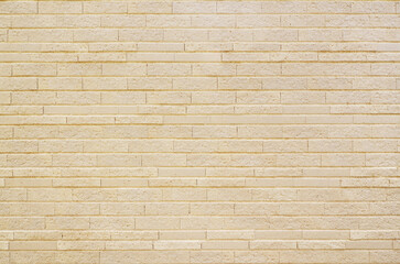 Champagne gold brick tile wall texture background. Vintage and modern exterior or interior backdrop design.