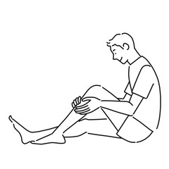 足のすねを触る若い男性