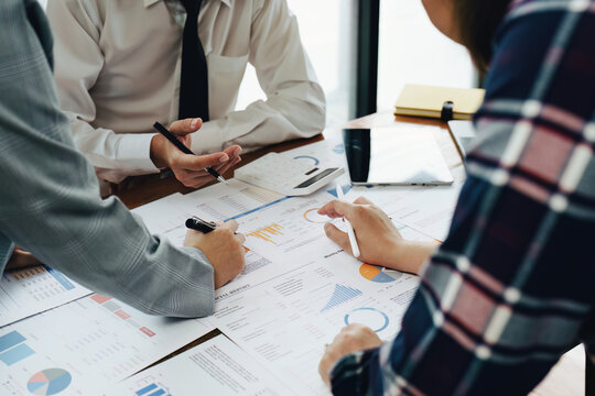 businesspeople working with partners adjusting marketing strategies