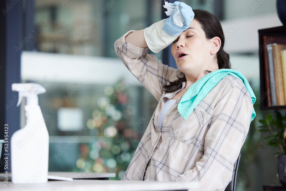 Canvas Prints Tired, stressed and frustrated cleaning lady resting after doing chores, hygiene and housework alone indoors. Exhausted and overworked domestic housewife wiping sweat with gloves on a break at home