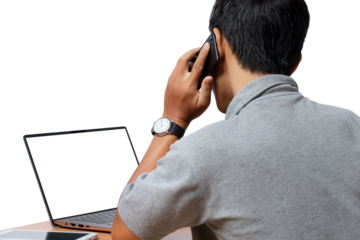 Young man using smartphone and computer laptop.