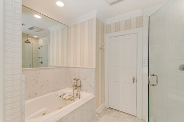 Fototapeta na wymiar luxury interior bathroom striped wallpaper glass shower