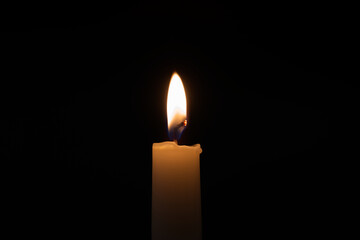 Candle flame against a black background