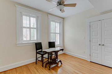 interior office space plantation shutters empty room hardwood floors