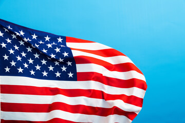 American flag waving on blue background