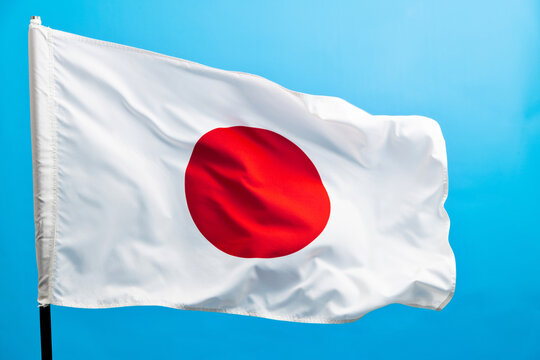 Japan flag waving on blue background