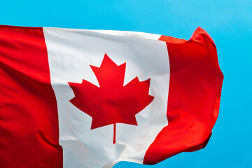 Canada flag waving on blue background
