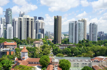 Beautiful Singapore skyline panorama with blue skies and puffy clouds. 
