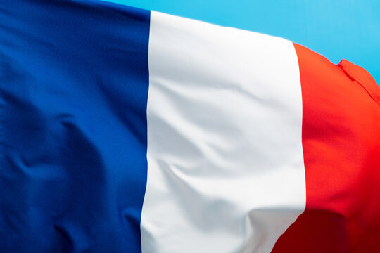French flag waving on blue background