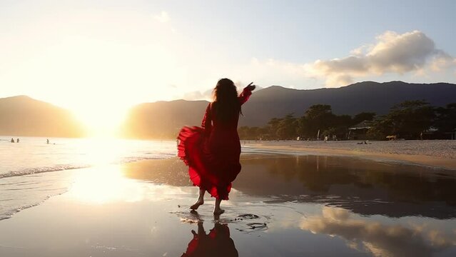 Woman in red dress dancing flamenco on beach at sunset. Gimbal circling, slomo