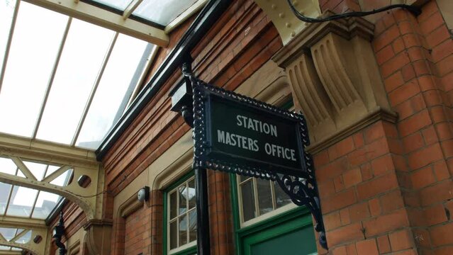 Close up of a station master's office sign at an old British railway train station