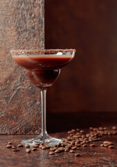 Coffee and chocolate cocktail on a brown background.