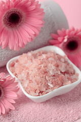 Spa composition with pink salt.