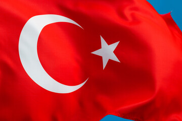 Obraz premium Turkish flag waving on blue background