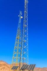 Communication towers and solar panels in a bedouin village in Sinai desert, Egypt