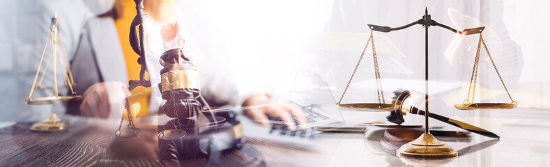 Justice and law concept. Gavel on sounding block in hand's Male judge at a courtroom, working with document law books, report the case on table in modern office.