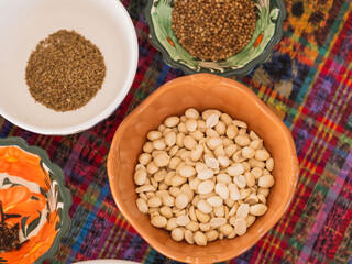 Fototapeta premium Horizontal overhead image of ingredients in bowls on a traditional tablecloth 