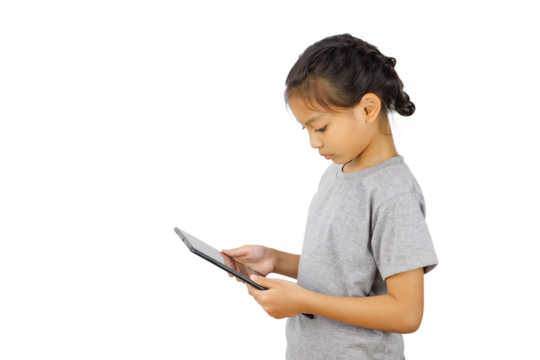 Little girl playing with a digital tablet