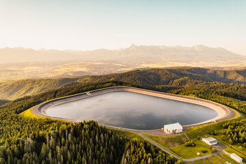 Hydroelectric power plant Cierny Vah. Sunset in Slovakia, Liptov. High Tatras scenery. Monumental...