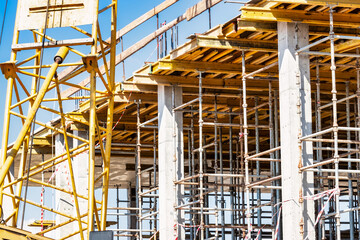 Formwork for pouring the second floor of a monolithic building. Reinforcement of walls and ceiling. Monolithic work during the construction of a building close-up. Construction technologies.