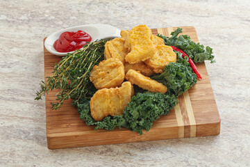 Crispy chicken nuggets with tomato ketchup