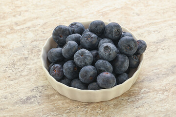 Sweet ripe blueberry heap in the bowl