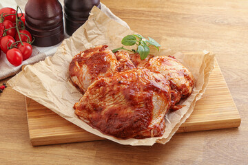 Marinated chicken leg in tomato sauce