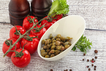 Marinated green capers in the bowl