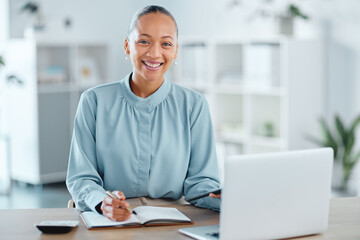 Modern, smiling and young business woman enjoying her work in a office at a computer indoors. Portrait of a happy junior corporate lawyer working, making notes and planning a successful job strategy - obrazy, fototapety, plakaty