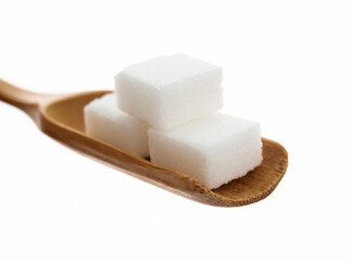 Sugar cubes in wooden scoop on white background