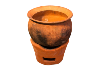 Clay pot on clay stove isolated