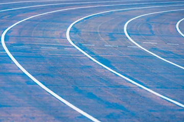 Foto op Aluminium background of blue track for running competition at stadium, focus on center. © bubbers