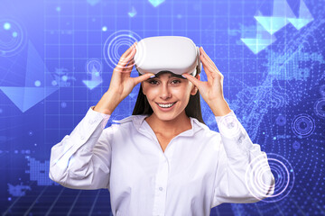 Happy young european businesswoman with VR glasses standing on creative glowing blue metaverse background. Cyberspace, augmented reality, future and technology concept.