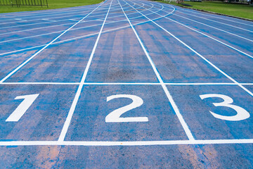 Starting line of blue running track.