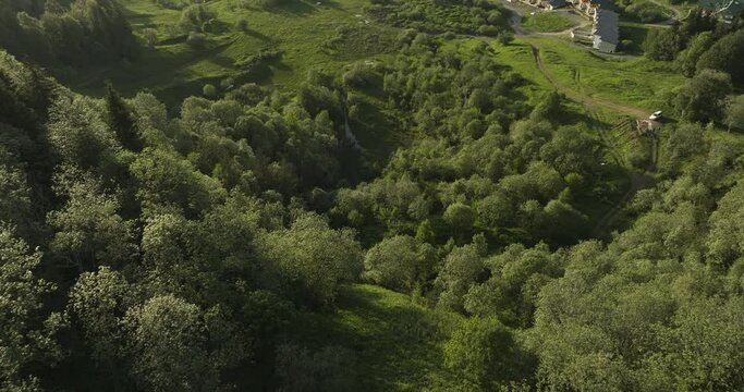 Mountain Slope Covered By Green Trees In The Small Town Of Bakuriani In Georgia. aerial drone
