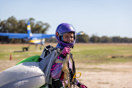 Skydiver returning to base with parachute after a jump