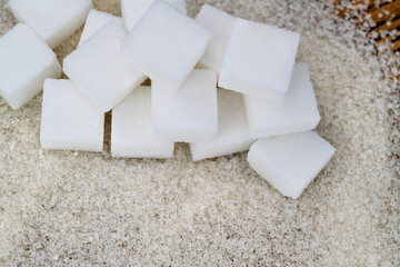Sugar cubes on top of granulated sugar