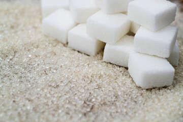 Sugar cubes on top of granulated sugar