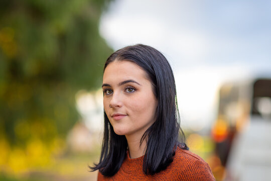 teen girl looking away with blurry background