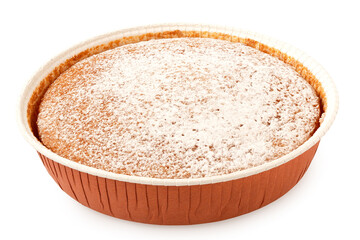Whole lemon sponge cake with icing sugar topping in a paper tray isolated on white.