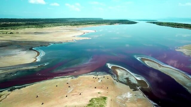 Aerial View Of Motorcycles On Flat Soda Lake Of Magadi In Rift Valley, Kenya, East Africa. 