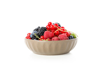 Bowl with berries isolated on white background